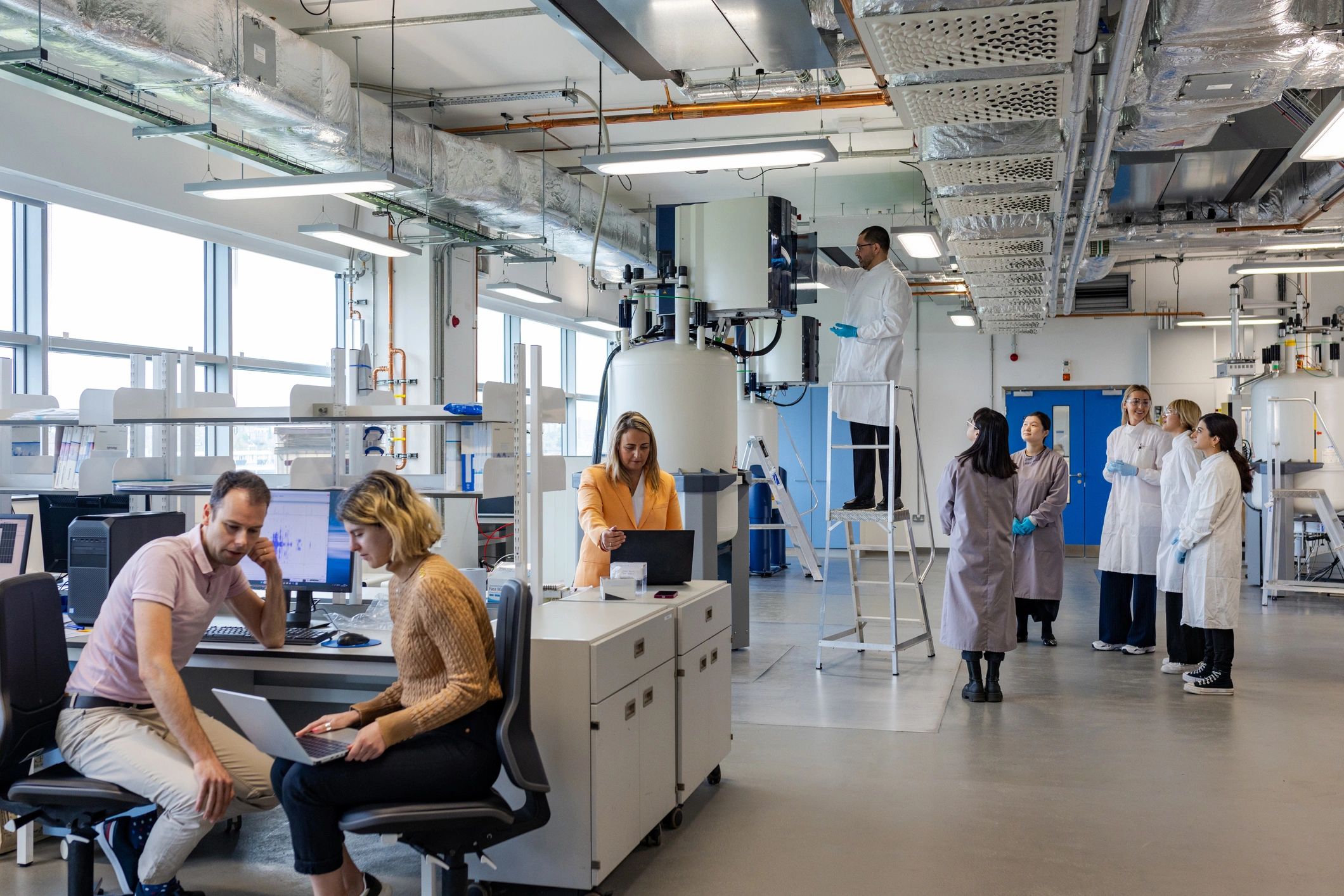 Engineers reviewing data in an industrial research laboratory