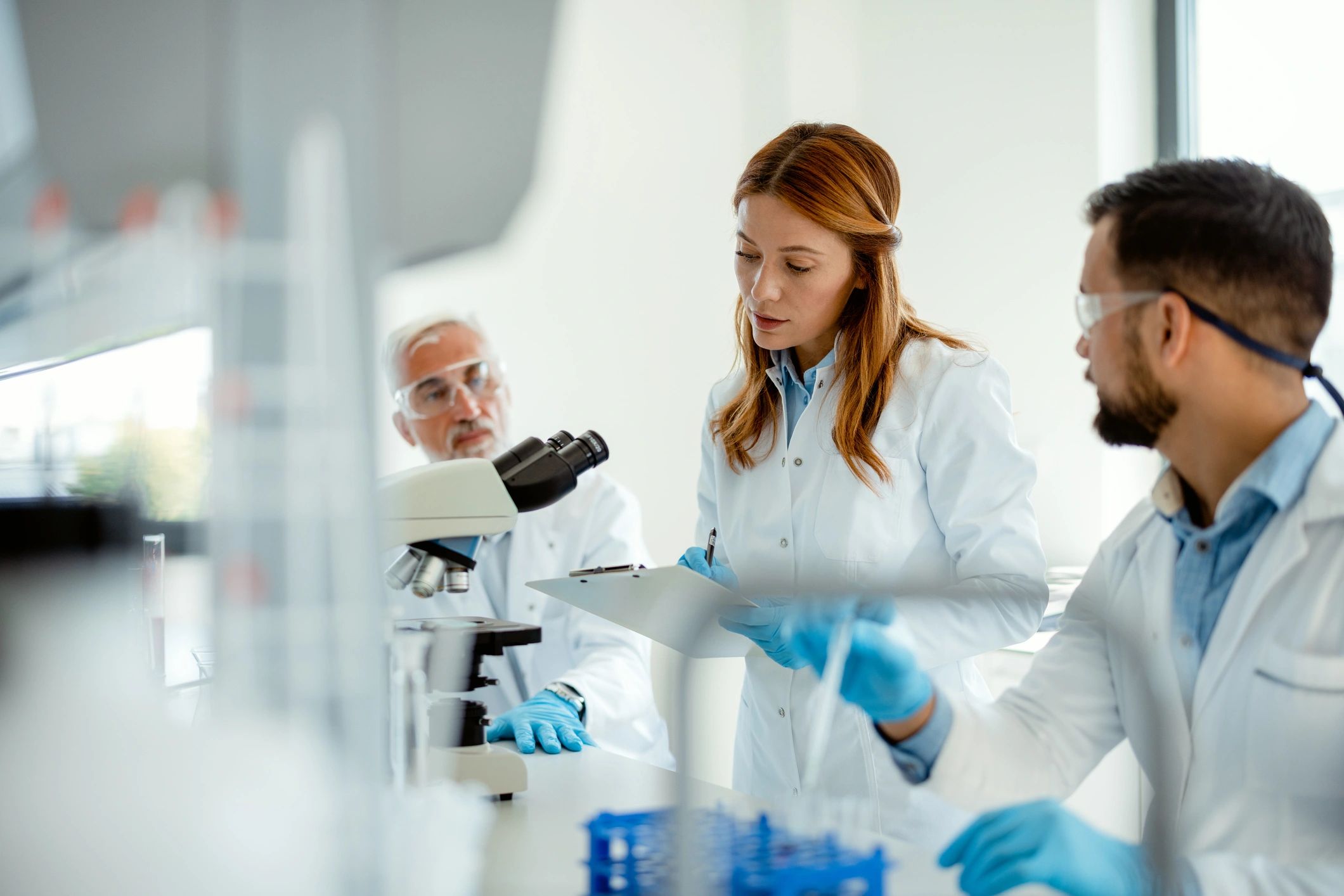Research team collaborating in a modern laboratory