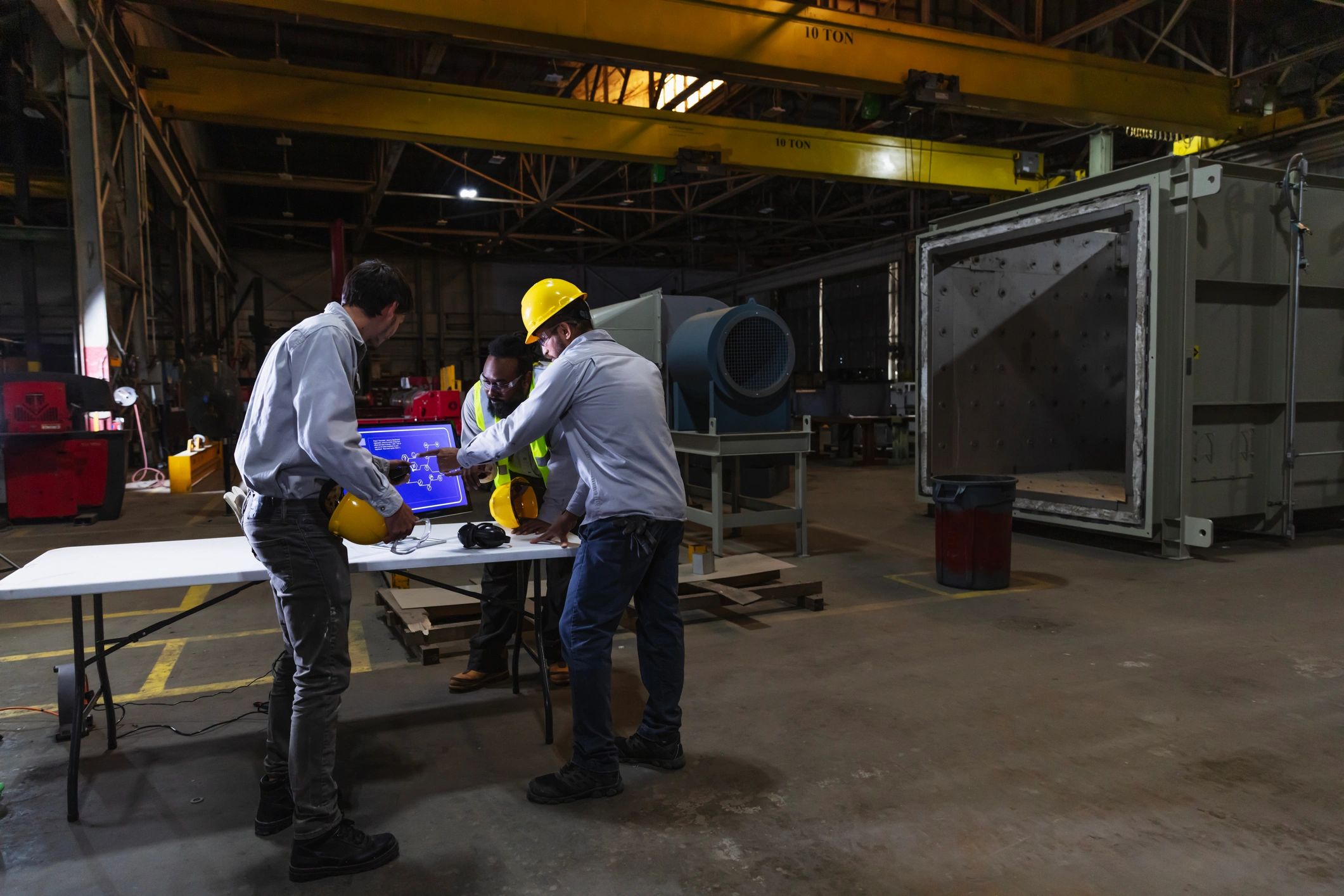 Manufacturing team reviewing production data for scale-up planning